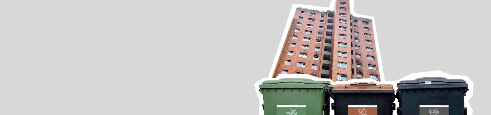 Abfalltrennung in Großwohnanlagen Abfalltonnen vor einem Mehrfamilienhaus